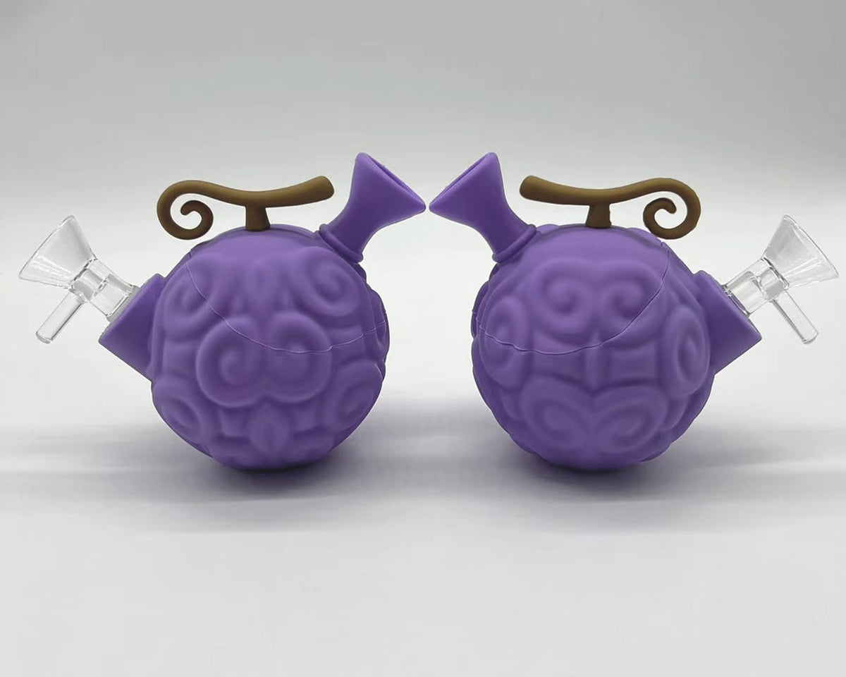 Two purple devil fruit silicone water pipes showing both sides and removable glass bowls