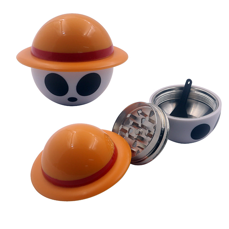 Pirate straw hat herb and spice grinder shown assembled and open with metal grinding plate, collection chamber, and scraper